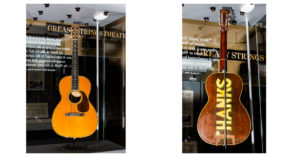 Left image: Guitar seen from the front in a museum exhibit case. You can see the inlay "Jimmie Rodgers" and "Blue Yodel" on the neck and headstock. Right image: Guitar seen from the back in museum exhibit case. "Thanks" is painted on the back of the guitar's body.