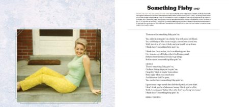 This image shows one of the inside spreads of the Songteller book. On the left page is a photograph of Dolly in her younger years. She is sitting on a front porch/steps area in a mint green tank top and yellow pants. Her blond hair is pulled up and away from her face. The right page has the lyrics to one of her songs, "Something Fishy."